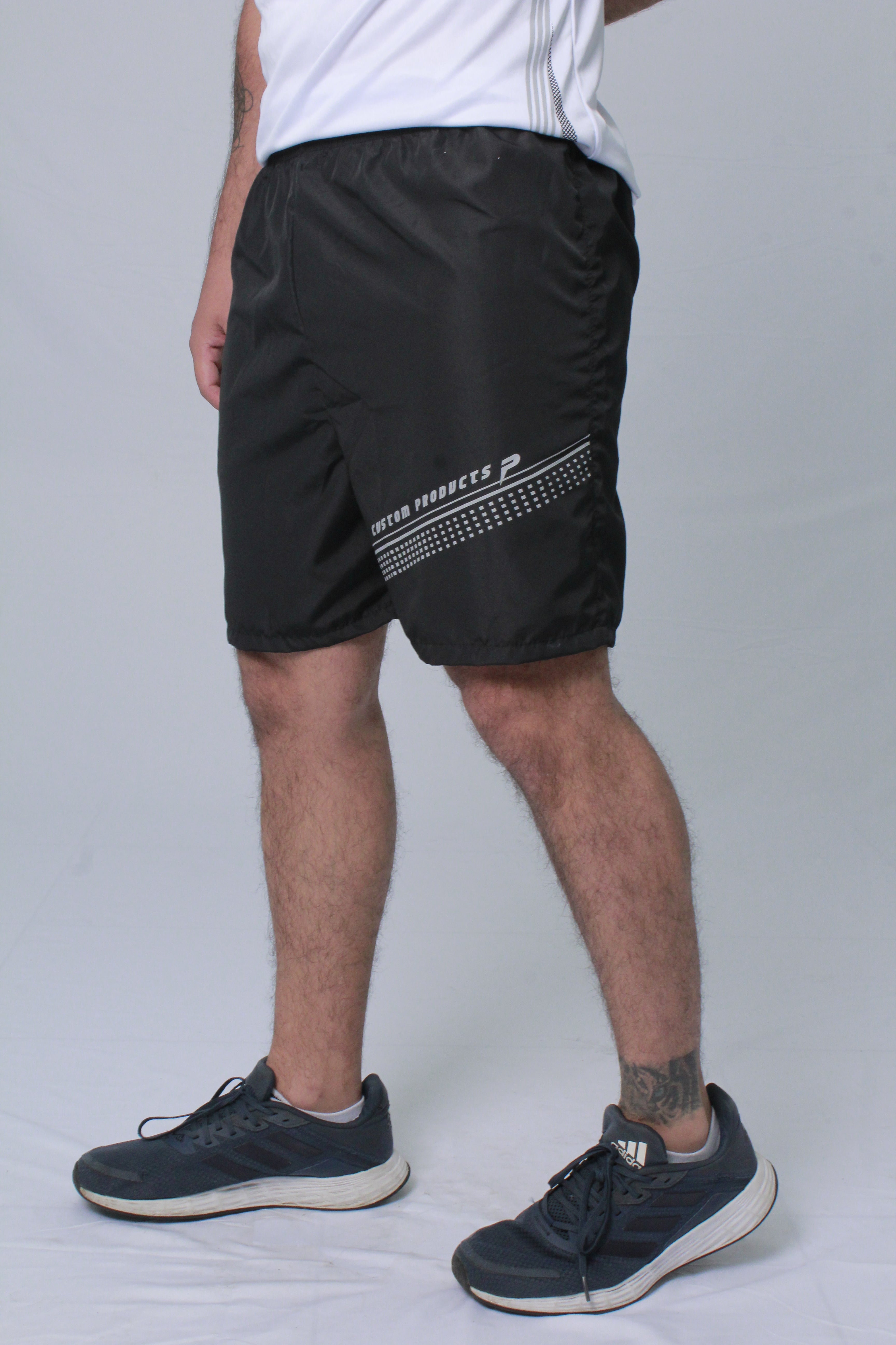 Pantaloneta deportiva hombre estampado delantero