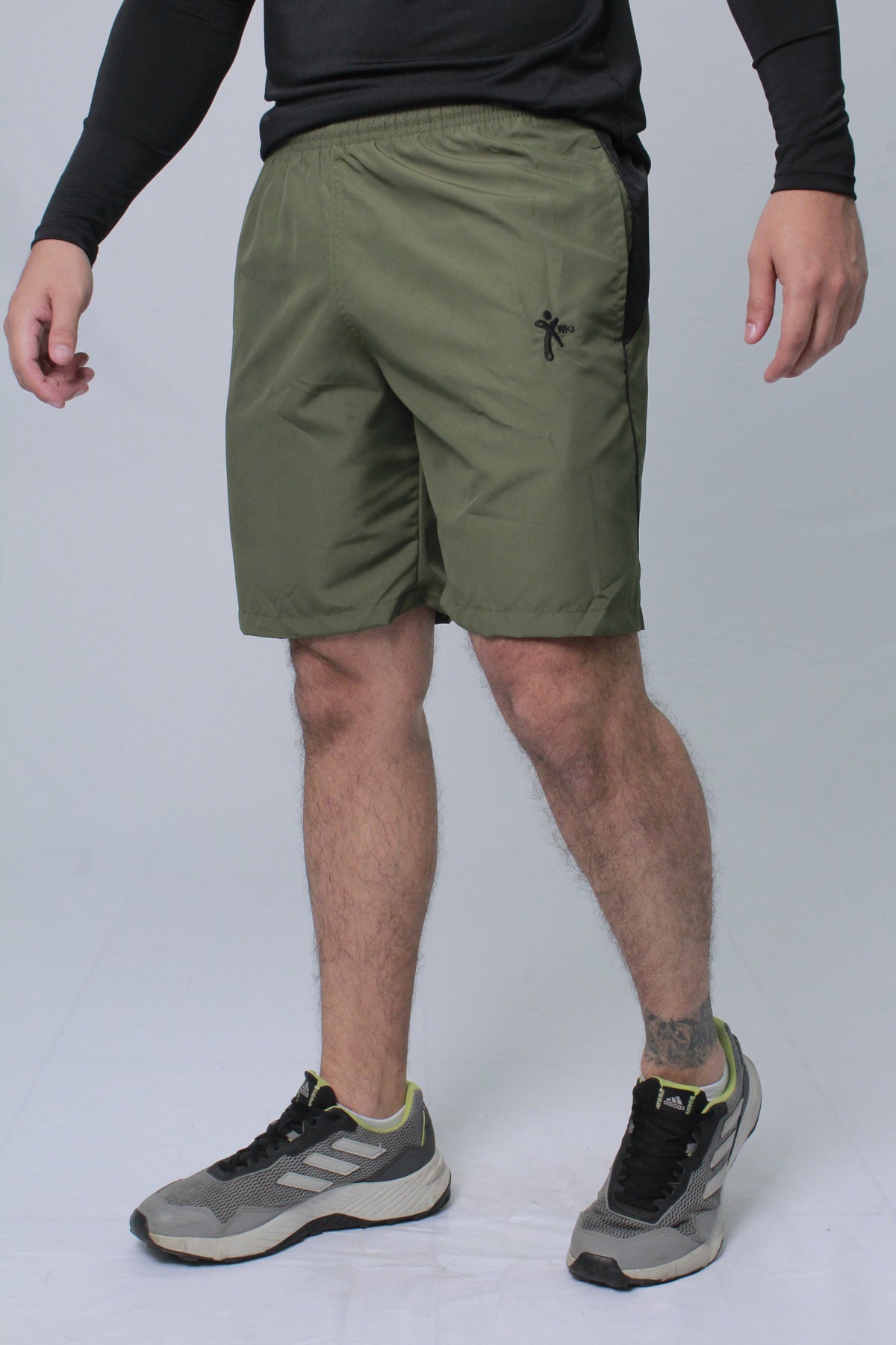 Pantaloneta Deportiva NKI hombre con bolsillo lateral